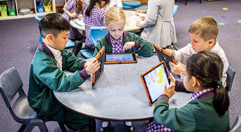 Kids on iPads at Holy Cross Catholic Primary Glenwood