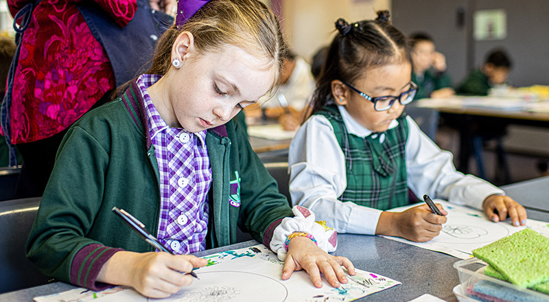 Girls learning at Holy Cross Catholic Primary Glenwood