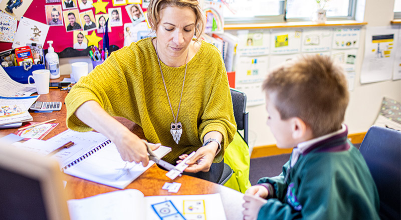 Teacher with student at Holy Cross Primary Glenwood