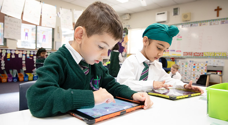 Holy Cross Catholic Primary Glenwood boys using iPads in class