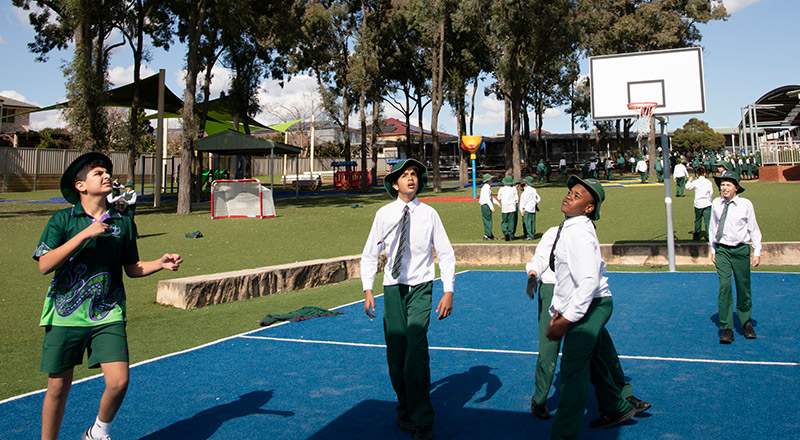 Holy Cross Catholic Primary Glenwood students playing basketball